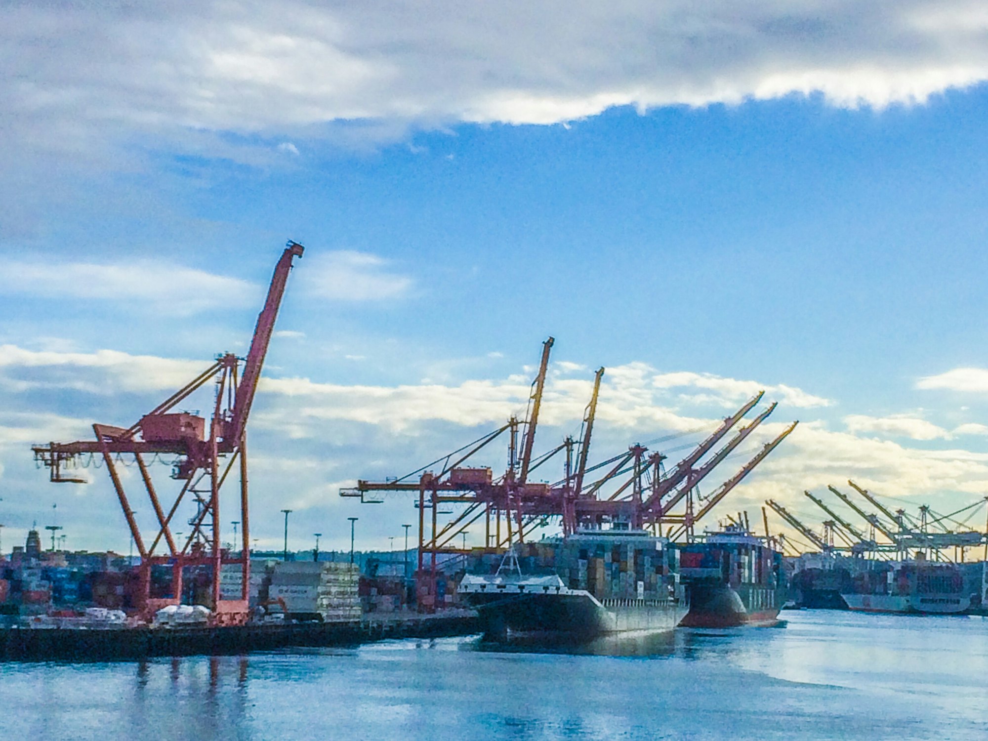 Shipping port cranes and cargo ships.